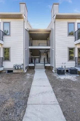 a view of a patio with table and chairs