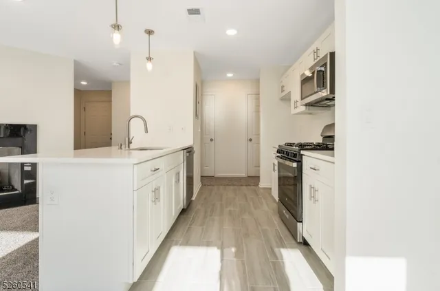 a kitchen with cabinets and white appliances