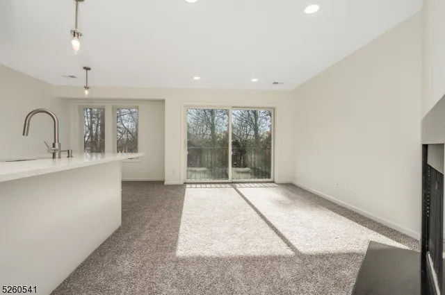 a view of entryway with kitchen