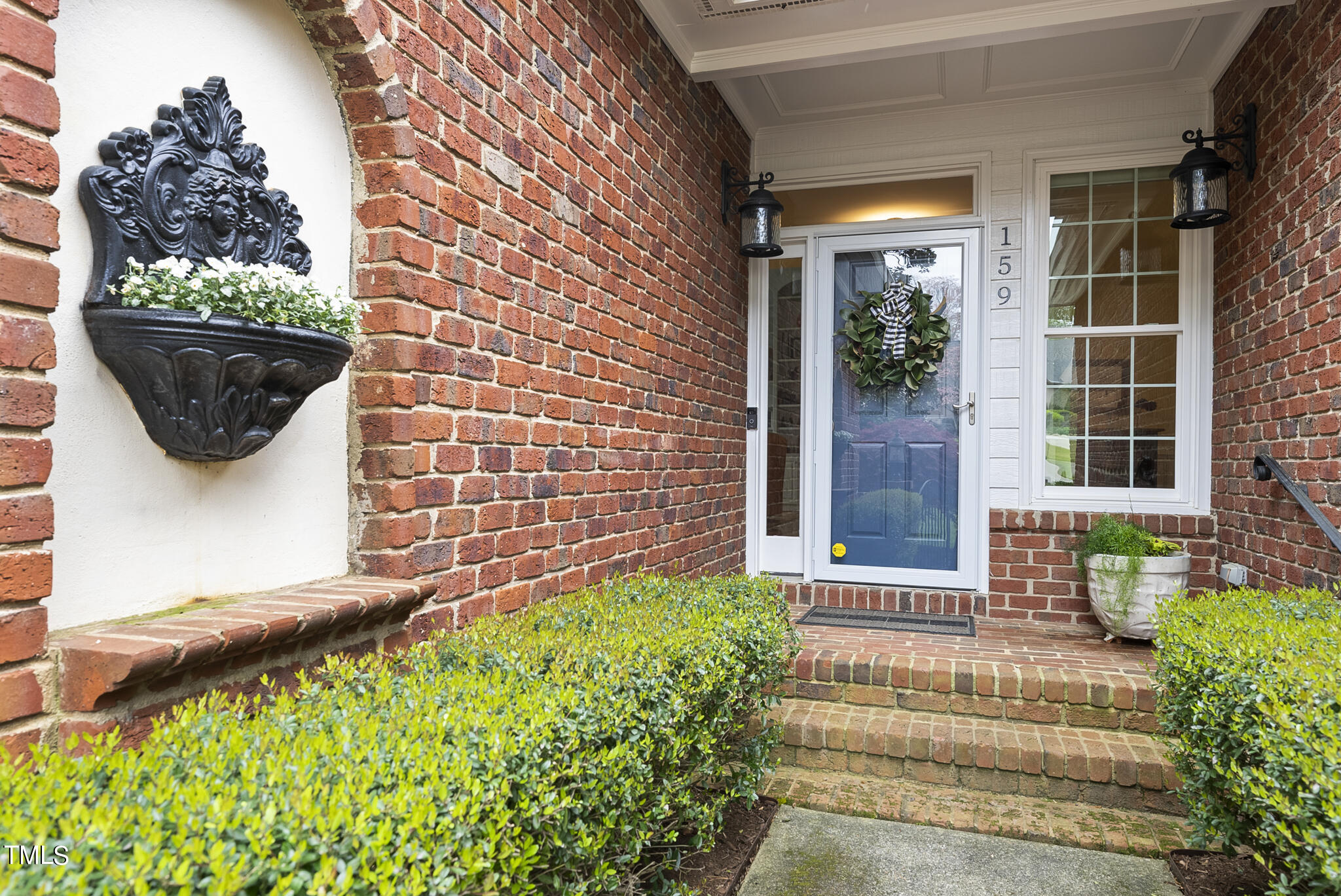 159 Yorkchester Way Raleigh, NC 27615 - Photo 3 of 46 a front view of a house with a garden