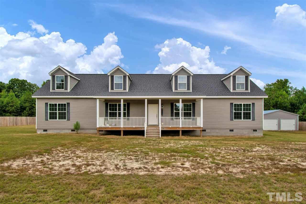 1298 L L Cooper Road Cameron, NC 28326 - Photo 1 of 30 a front view of a house with a yard