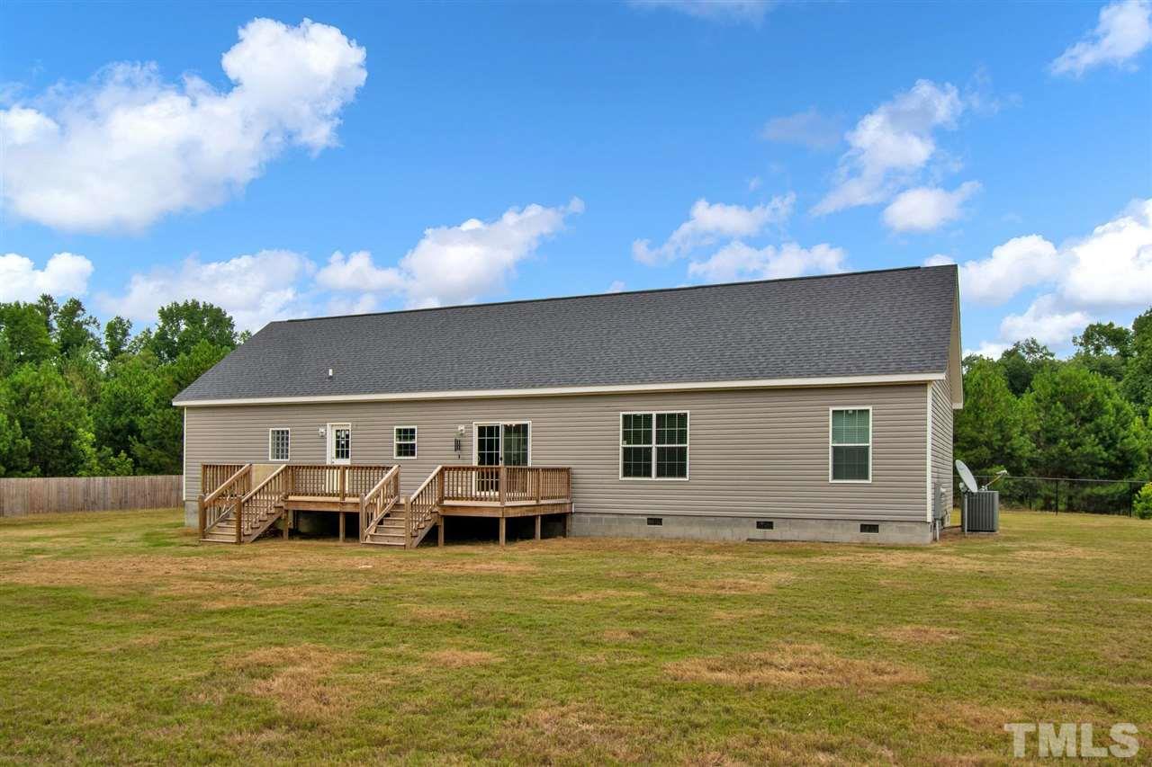 1298 L L Cooper Road Cameron, NC 28326 - Photo 2 of 30 a front view of house with yard and seating