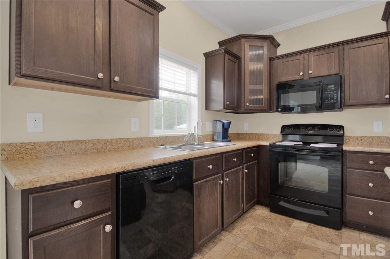 1298 L L Cooper Road Cameron, NC 28326 - Photo 11 of 30 a kitchen with a sink and a stove top oven