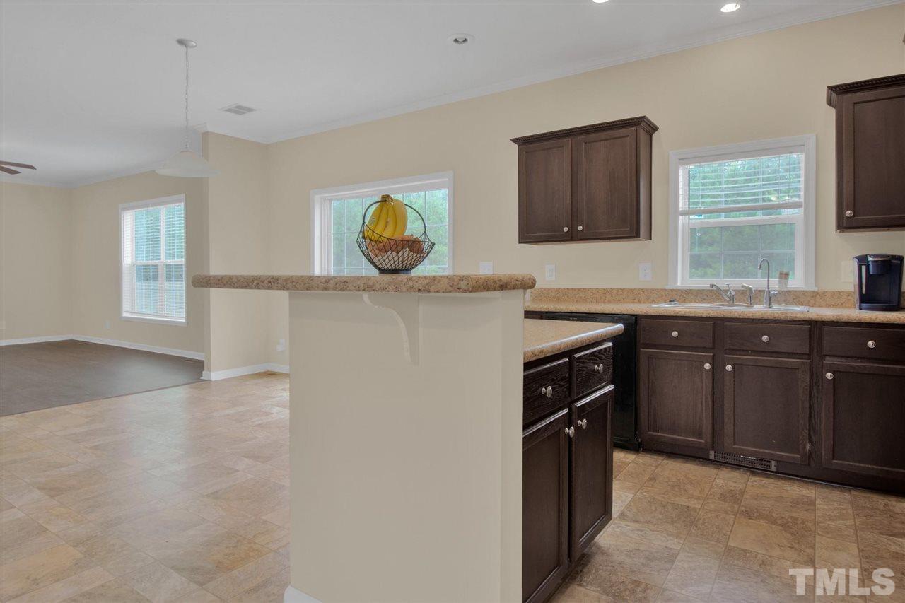1298 L L Cooper Road Cameron, NC 28326 - Photo 13 of 30 a kitchen with a sink and a stove