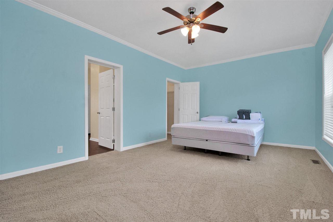 1298 L L Cooper Road Cameron, NC 28326 - Photo 16 of 30 a bedroom with furniture and a ceiling fan