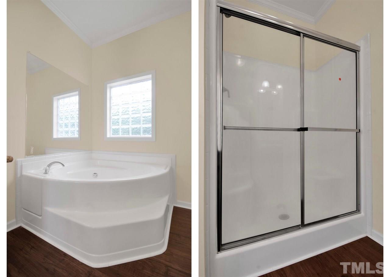 1298 L L Cooper Road Cameron, NC 28326 - Photo 19 of 30 a bathroom with a bathtub and a shower
