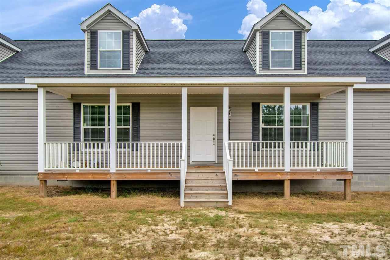 1298 L L Cooper Road Cameron, NC 28326 - Photo 3 of 30 front view of a house with a porch