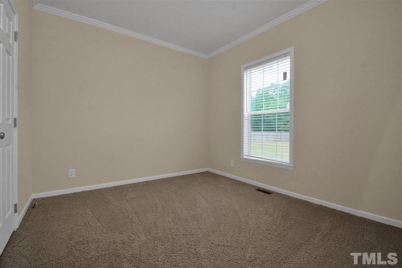 1298 L L Cooper Road Cameron, NC 28326 - Photo 22 of 30 an empty room with a window