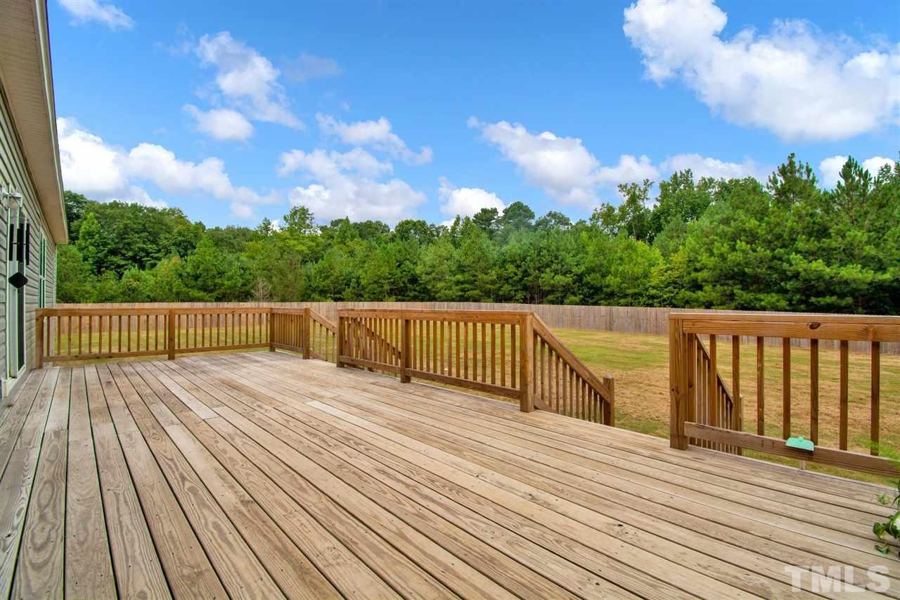 1298 L L Cooper Road Cameron, NC 28326 - Photo 27 of 30 a view of deck with wooden floor and fence