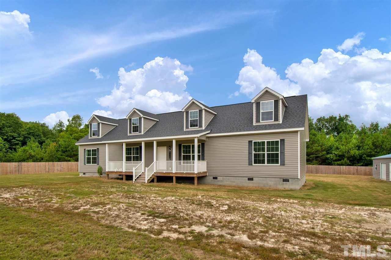 1298 L L Cooper Road Cameron, NC 28326 - Photo 29 of 30 a view of a house with a swimming pool