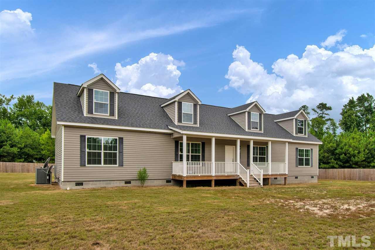 1298 L L Cooper Road Cameron, NC 28326 - Photo 30 of 30 a view of a house with a swimming pool