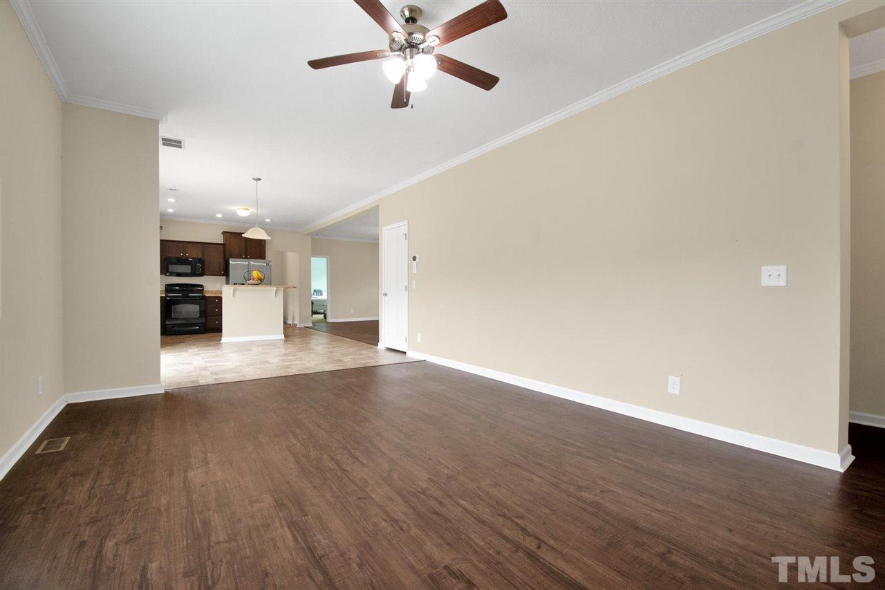 1298 L L Cooper Road Cameron, NC 28326 - Photo 7 of 30 wooden floor in an empty room with a window