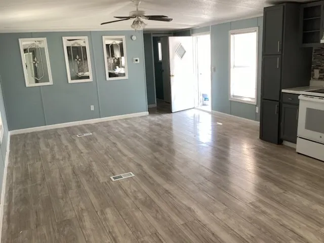 a view of livingroom with hardwood floor and hallway