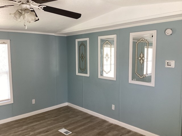 306 West Wallisville Road Highlands, TX 77562 - Photo 3 of 14 a view of an empty room with wooden floor and a window