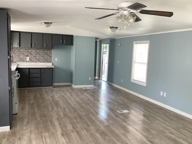 306 West Wallisville Road Highlands, TX 77562 - Photo 4 of 14 a view of an empty room with window and wooden floor