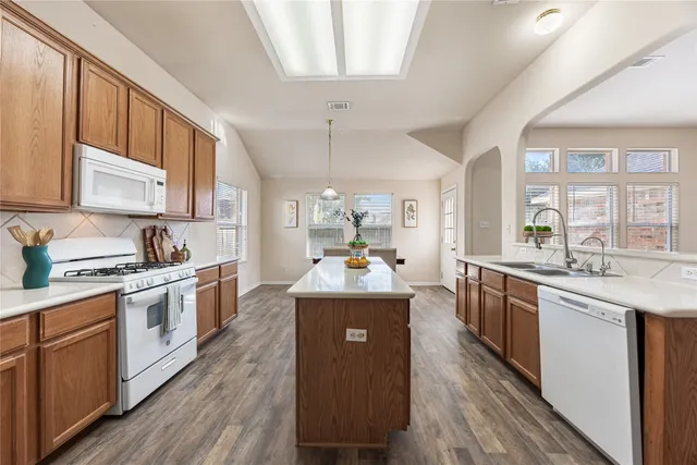 a kitchen with a stove and a refrigerator