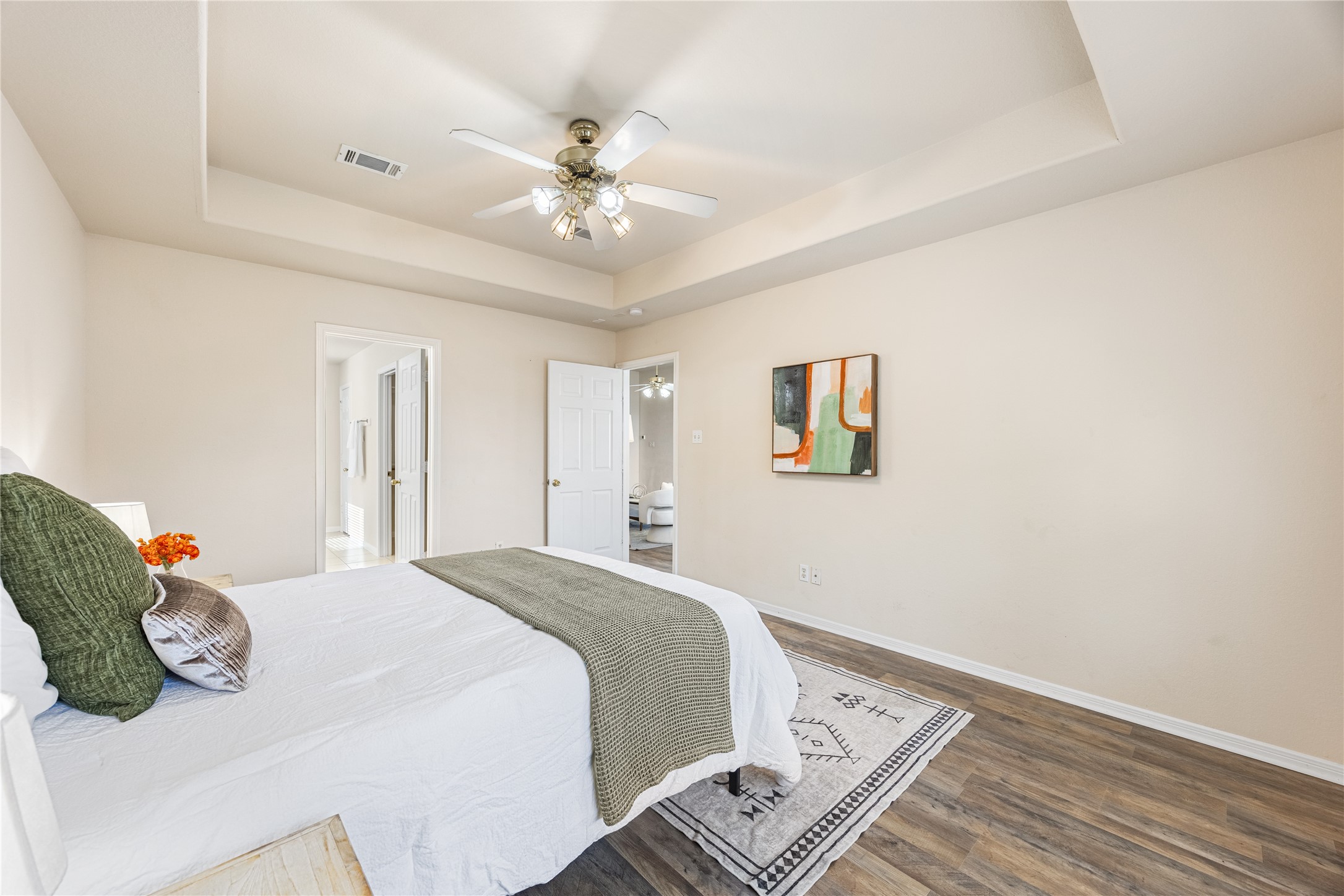 18739 Appletree Ridge Road Houston, TX 77084 - Photo 16 of 34 a bedroom with a bed and a chandelier