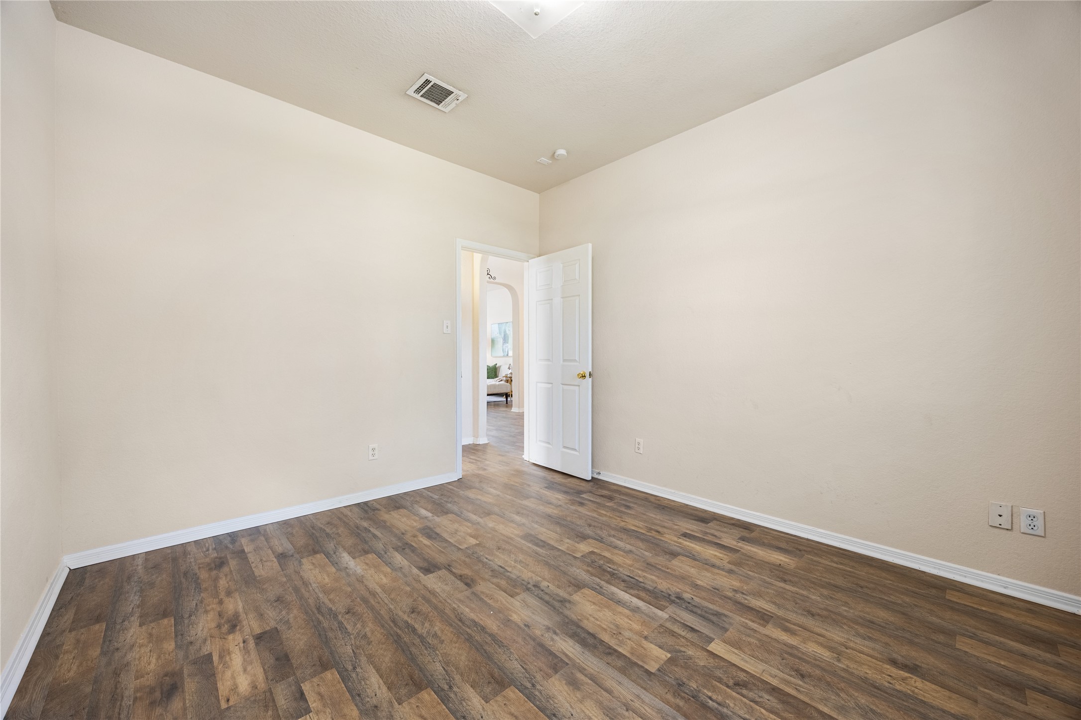 18739 Appletree Ridge Road Houston, TX 77084 - Photo 24 of 34 a view of an empty room with wooden floor
