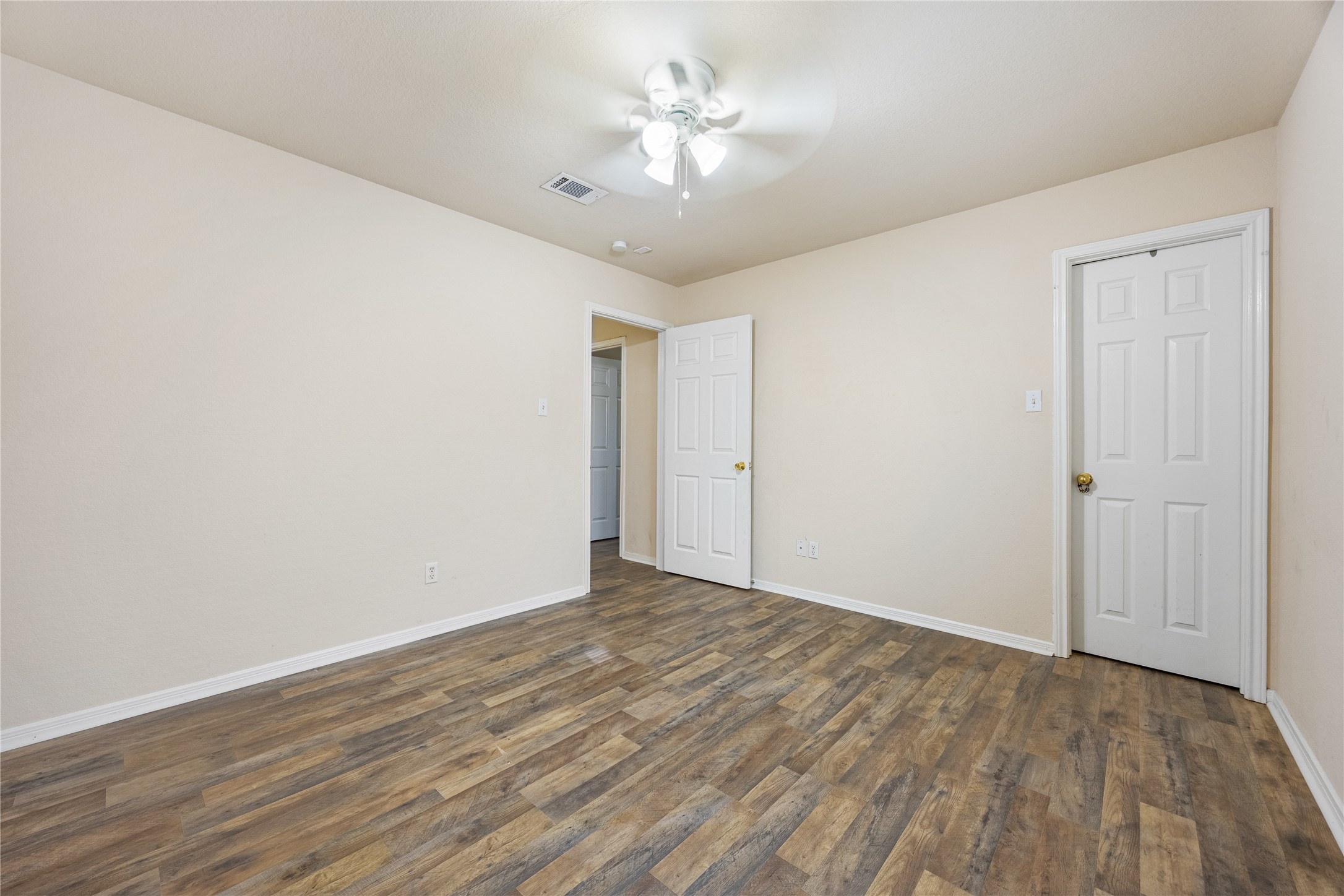 18739 Appletree Ridge Road Houston, TX 77084 - Photo 27 of 34 a view of a room with an empty space and a ceiling fan