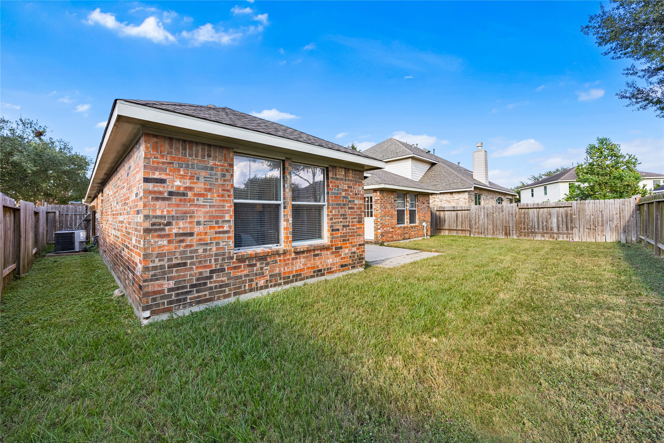 18739 Appletree Ridge Road Houston, TX 77084 - Photo 30 of 34 a front view of a house with a garden