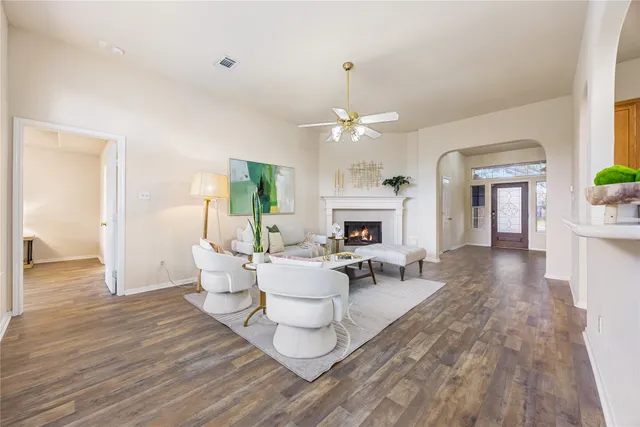 a living room with furniture and a fireplace