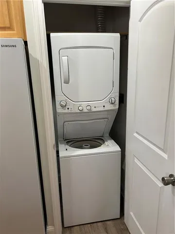 a bedroom with a bed mirror and window