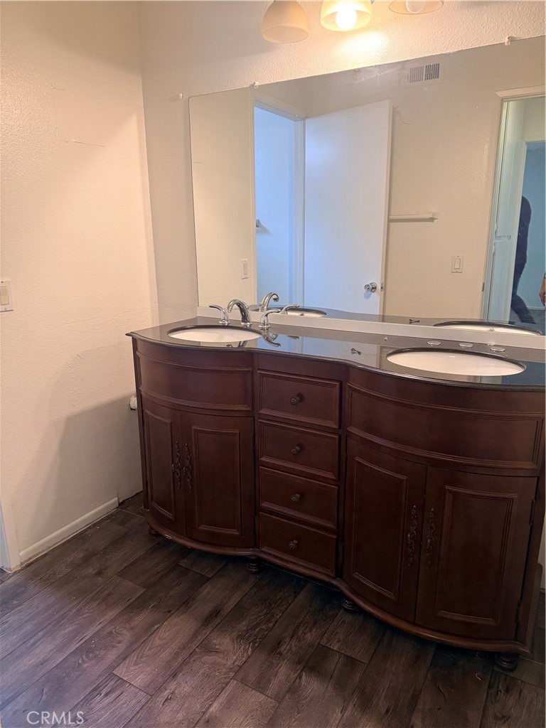 8990 19th Street, Unit 222 Rancho Cucamonga, CA 91701 - Photo 4 of 8 a bathroom with a sink and a mirror