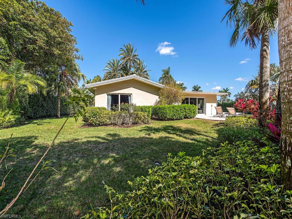 540 Rudder Road Naples, FL 34102 - Photo 12 of 12 a view of a house with a yard