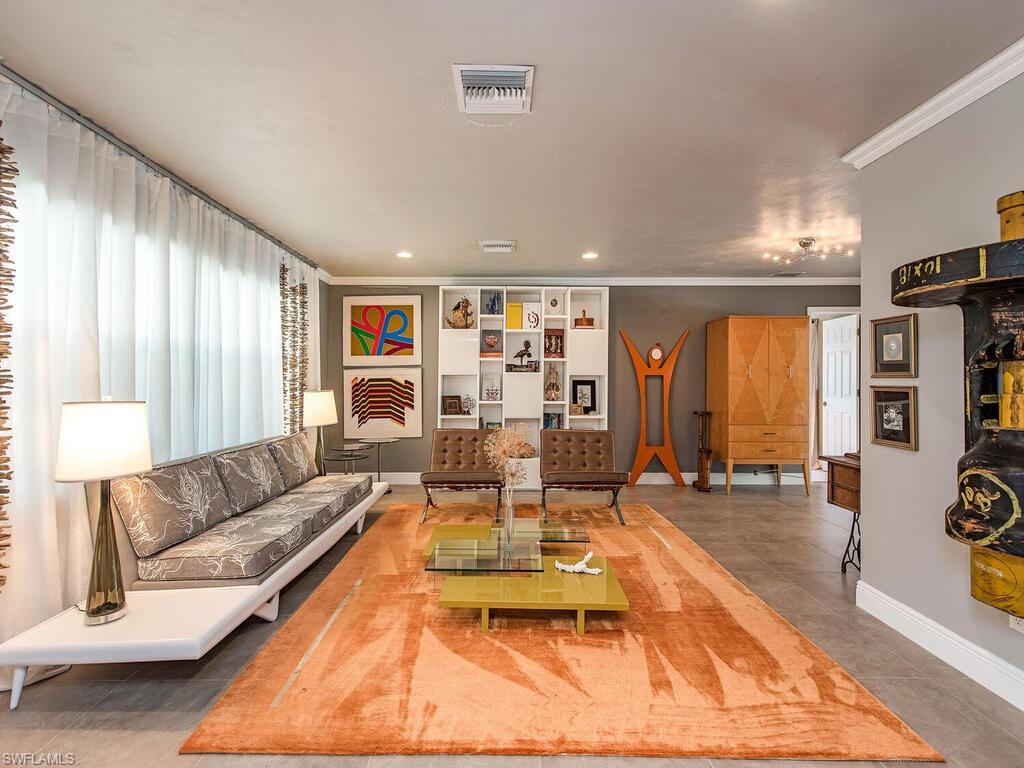 540 Rudder Road Naples, FL 34102 - Photo 3 of 12 a living room with furniture and large window