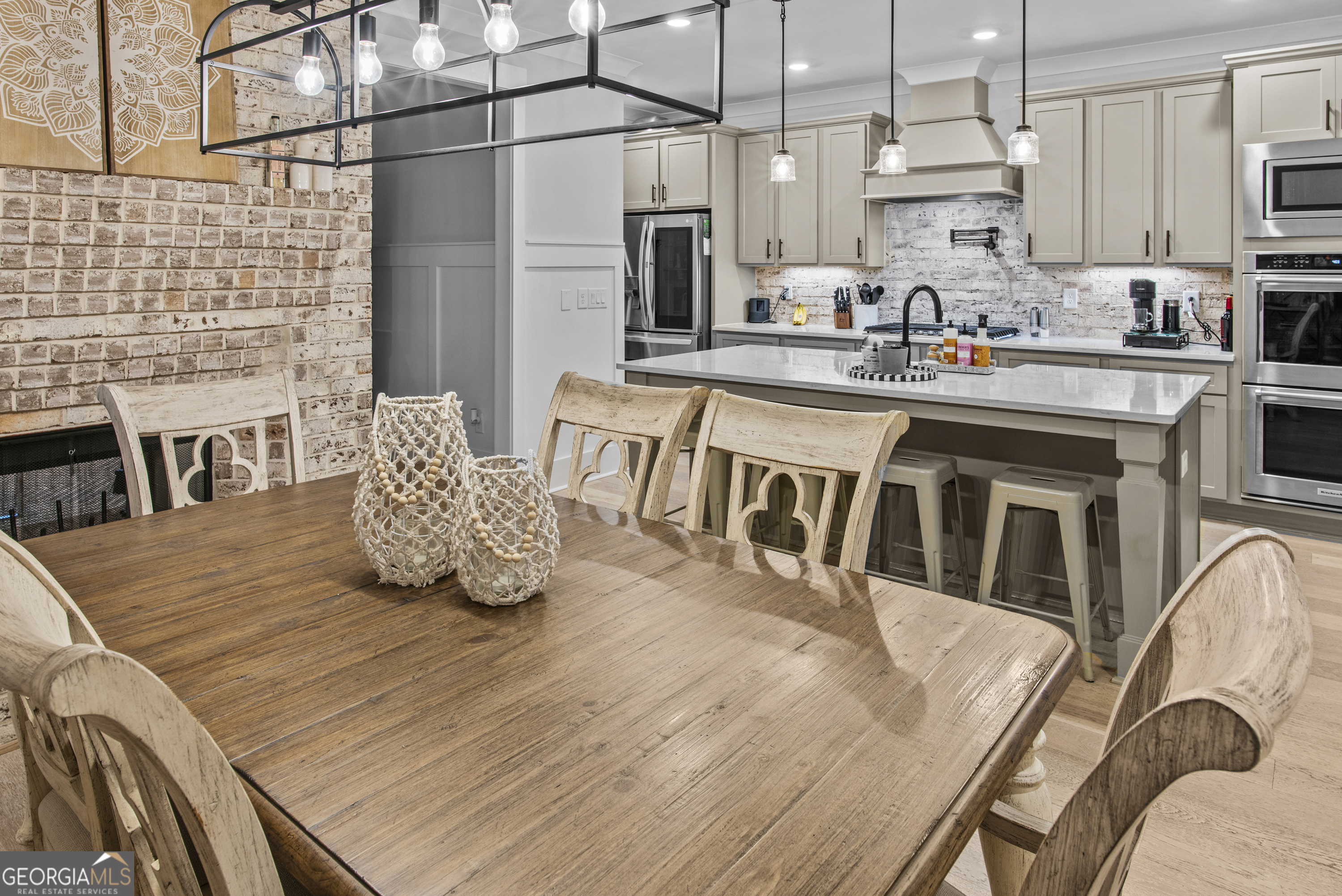 265 Federal Street Athens, GA 30607 - Photo 17 of 61 a kitchen with stainless steel appliances granite countertop a stove a sink a refrigerator white cabinets and wooden floor