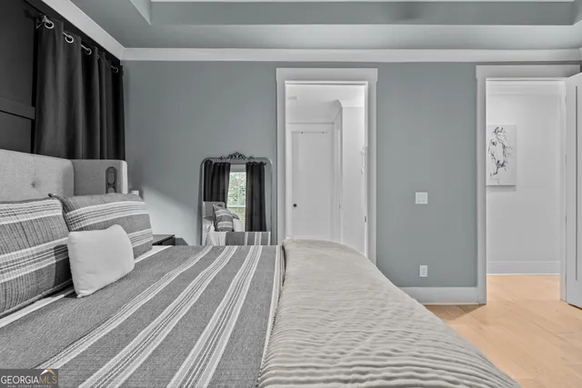 a bathroom with a granite countertop toilet and a sink