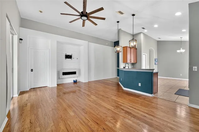 a view of a kitchen with a sink and a window
