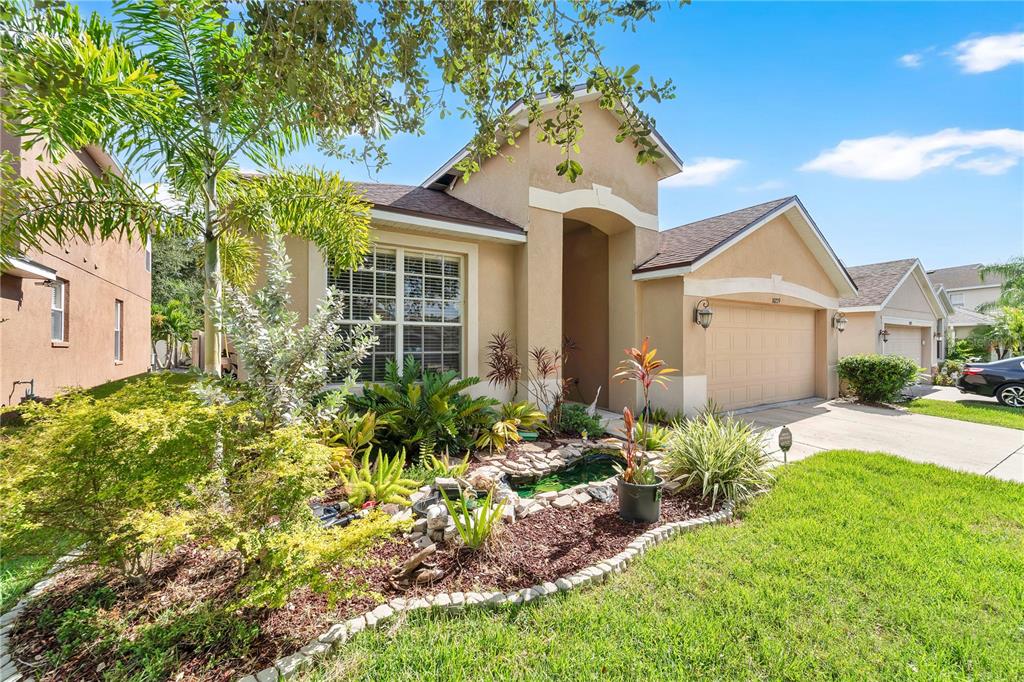 10229 Avelar Ridge Drive Riverview, FL 33578 - Photo 2 of 39 front view of a house with a yard