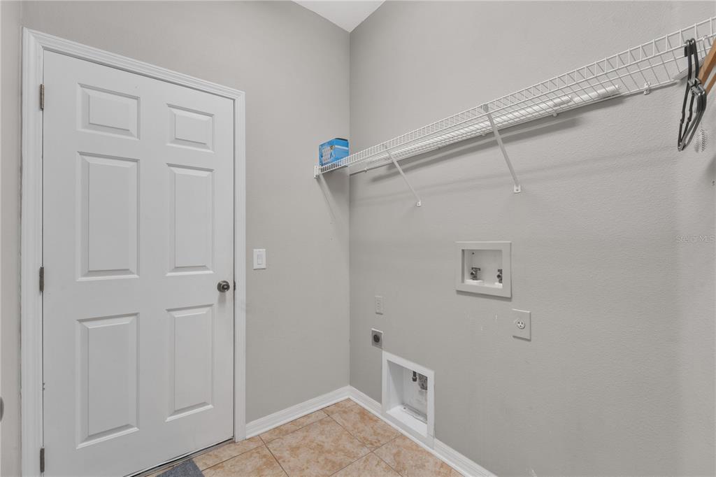 10229 Avelar Ridge Drive Riverview, FL 33578 - Photo 26 of 39 a view of small space with racks on the wall