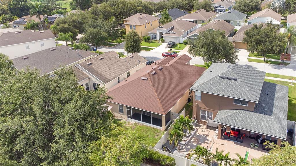 10229 Avelar Ridge Drive Riverview, FL 33578 - Photo 33 of 39 an aerial view of multiple houses with yard