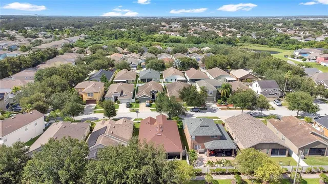an aerial view of residential houses with outdoor space