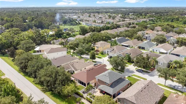 an aerial view of residential houses with outdoor space