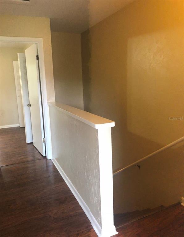 2735 Southwest 35th Place, Unit 403 Gainesville, FL 32608 - Photo 5 of 11 an entryway door with wooden floor