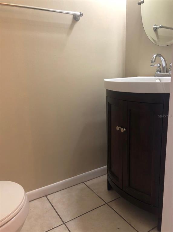 2735 Southwest 35th Place, Unit 403 Gainesville, FL 32608 - Photo 10 of 11 a bathroom with a sink and a toilet