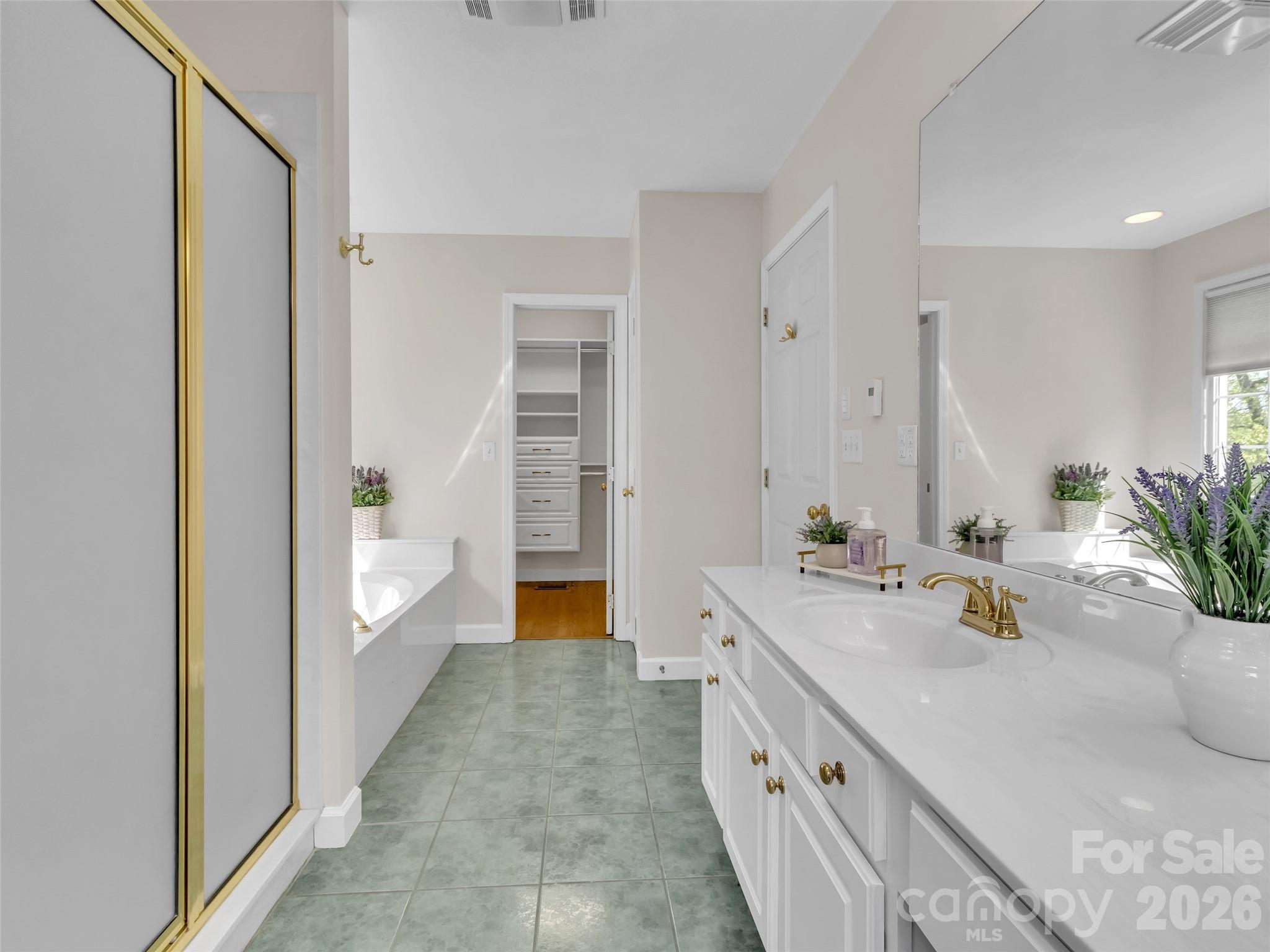 88 Adams Drive Clyde, NC 28721 - Photo 16 of 47 a spacious bathroom with a sink a mirror and a bathtub