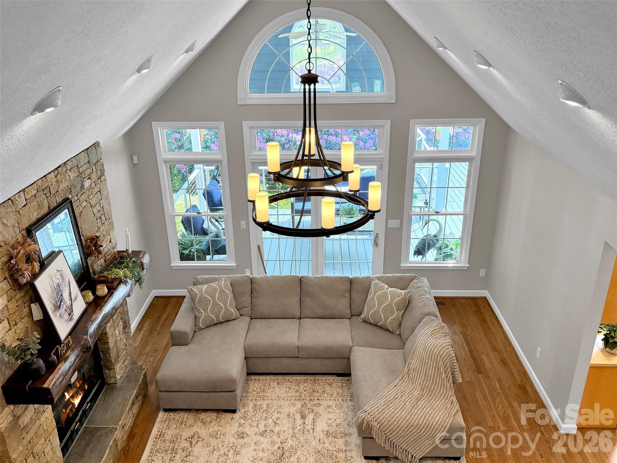 88 Adams Drive Clyde, NC 28721 - Photo 29 of 47 a living room with furniture and a flat screen tv