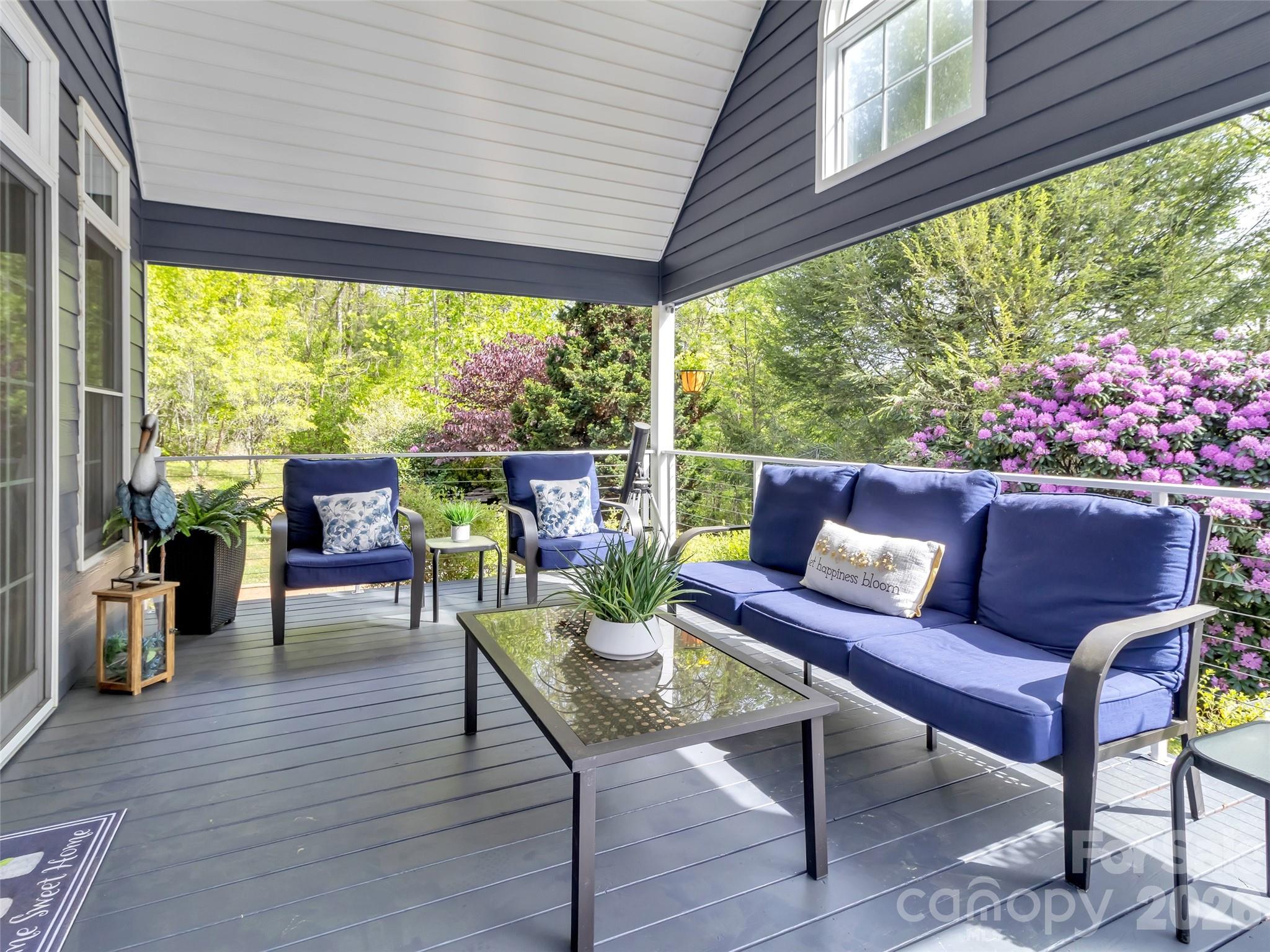 88 Adams Drive Clyde, NC 28721 - Photo 32 of 47 a outdoor living space with furniture and garden view