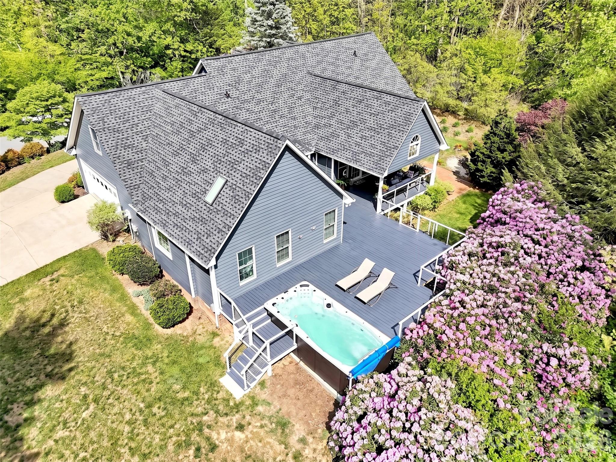 88 Adams Drive Clyde, NC 28721 - Photo 35 of 47 an aerial view of a house with a yard and potted plants