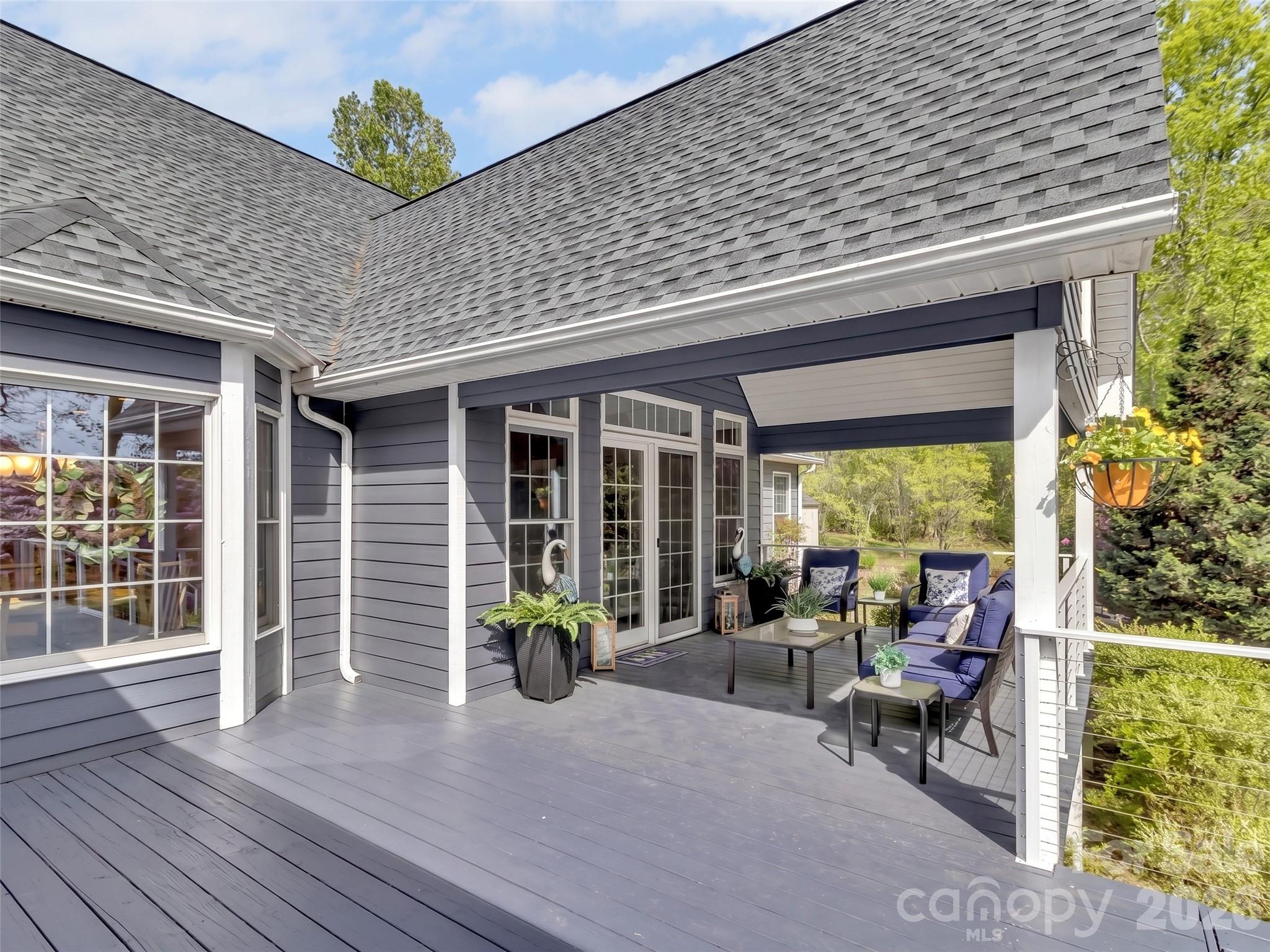 88 Adams Drive Clyde, NC 28721 - Photo 39 of 47 a front view of a house with sitting area and garden