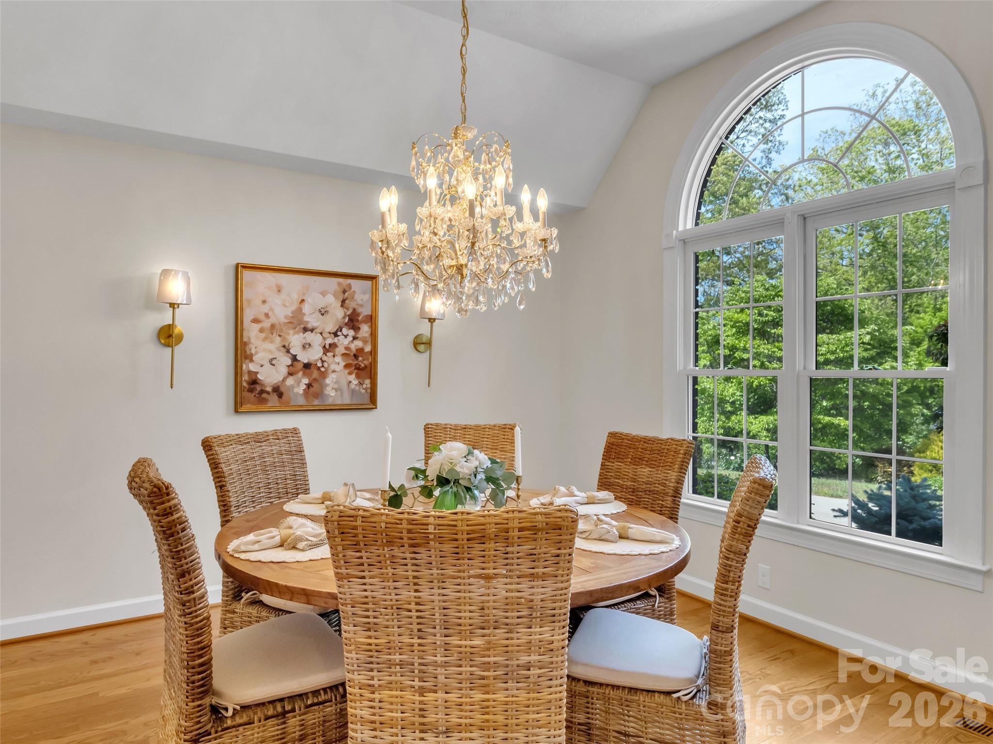 88 Adams Drive Clyde, NC 28721 - Photo 4 of 47 a view of a dining room with furniture a chandelier and wooden floor