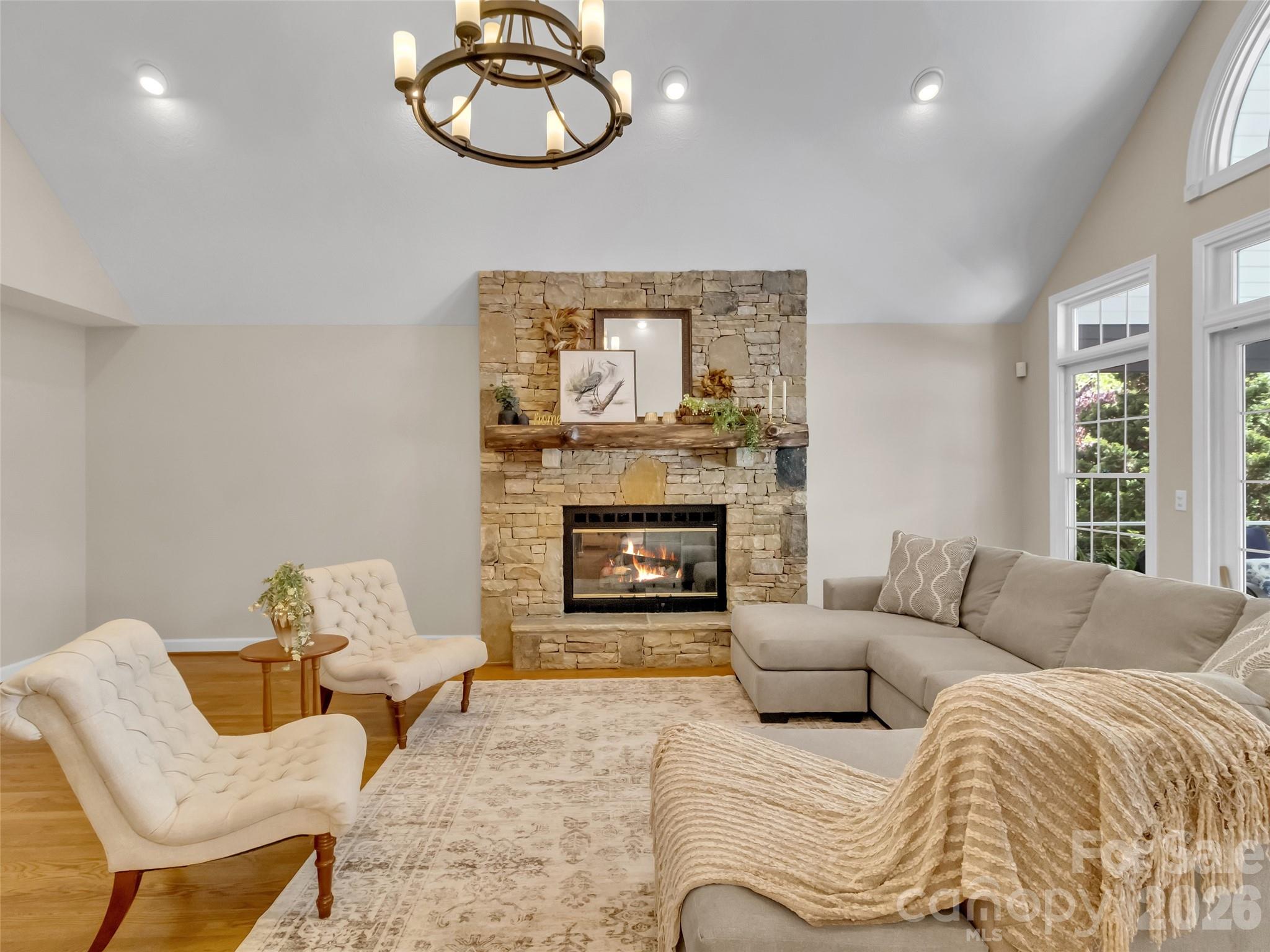 88 Adams Drive Clyde, NC 28721 - Photo 6 of 47 a living room with furniture a fireplace and window