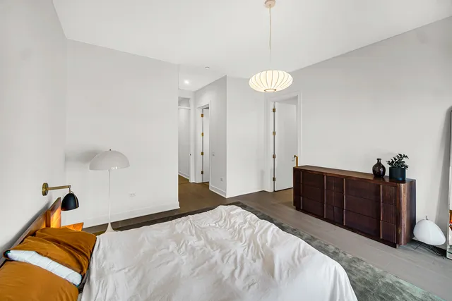 a bedroom with a bed and a closet