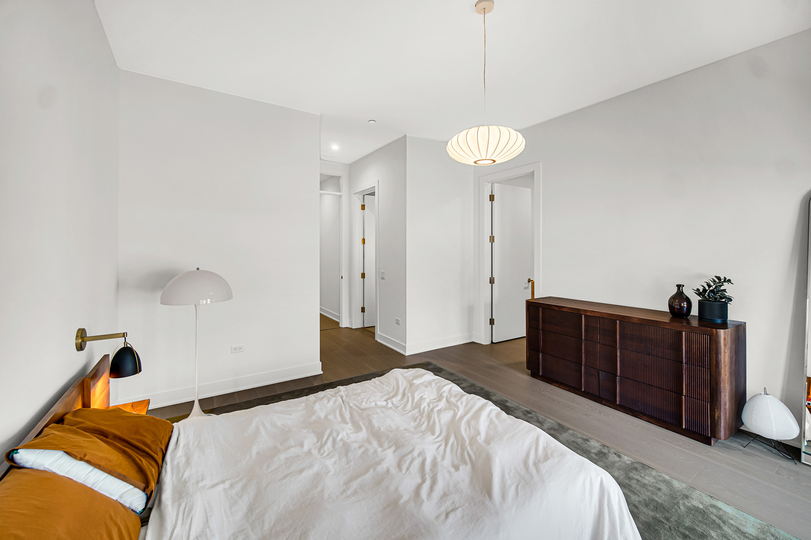 323 South Racine Avenue, Unit 5A Chicago, IL 60607 - Photo 13 of 26 a bedroom with a bed and a closet