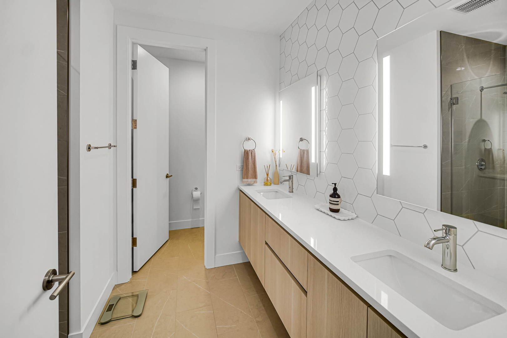 323 South Racine Avenue, Unit 5A Chicago, IL 60607 - Photo 14 of 26 a bathroom with a double vanity sink mirror and double