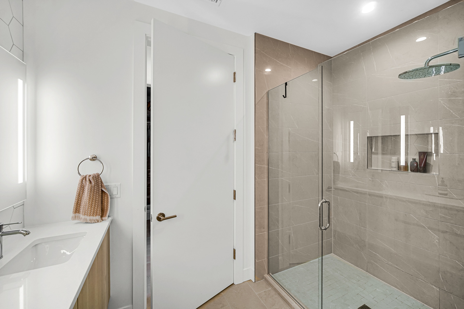 323 South Racine Avenue, Unit 5A Chicago, IL 60607 - Photo 15 of 26 a bathroom with a sink and a mirror
